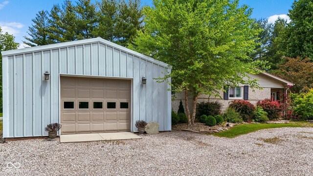 3480 W Broadus Dr, North Vernon, IN 47265 - detached garage featuring gravel driveway