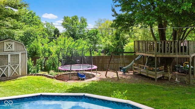 3480 W Broadus Dr, North Vernon, IN 47265 - view of pool with a playground and a trampoline