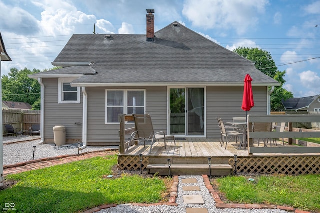 3360 Main St, Plainfield, IN 46168 - rear view of property with roof with shingles, a chimney, a deck, and outdoor dining space