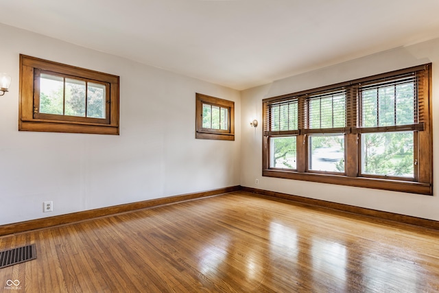 595 W Poplar St, Zionsville, IN 46077 - unfurnished room with baseboards, plenty of natural light, and hardwood / wood-style floors