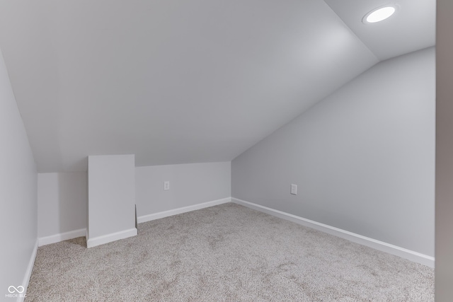 9317 E 36th Pl, Indianapolis, IN 46235 - additional living space with lofted ceiling, carpet flooring, and baseboards