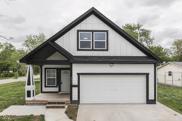 9317 E 36th Pl, Indianapolis, IN 46235 - view of front facade featuring board and batten siding, concrete driveway, and a porch