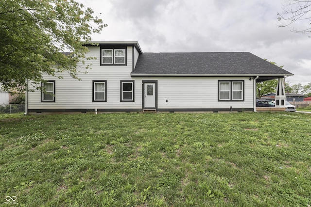 9317 E 36th Pl, Indianapolis, IN 46235 - back of property with crawl space, a yard, and a shingled roof