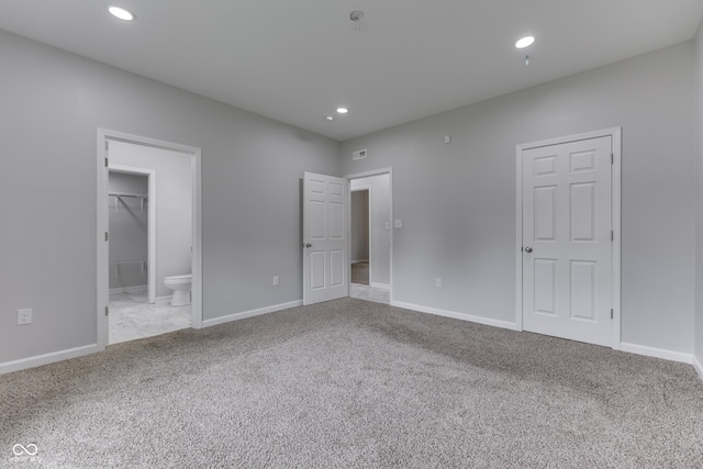 9317 E 36th Pl, Indianapolis, IN 46235 - unfurnished bedroom with carpet flooring, recessed lighting, baseboards, and connected bathroom
