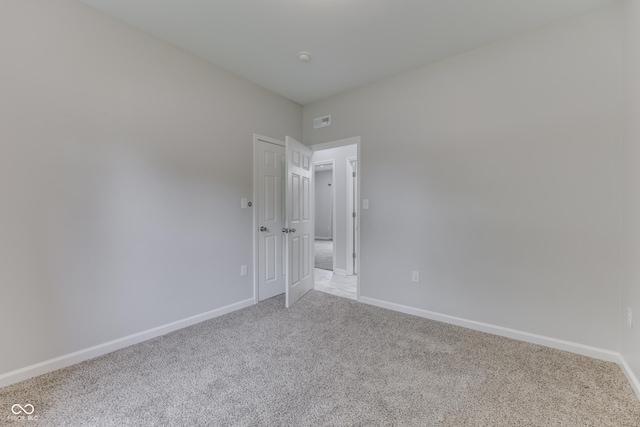 9317 E 36th Pl, Indianapolis, IN 46235 - spare room with carpet floors and baseboards