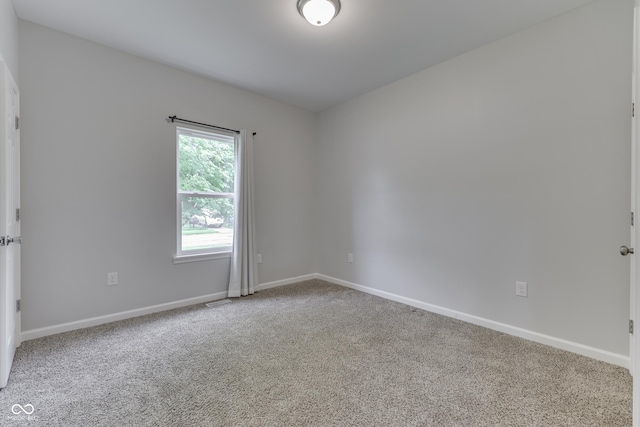 9317 E 36th Pl, Indianapolis, IN 46235 - carpeted spare room featuring baseboards