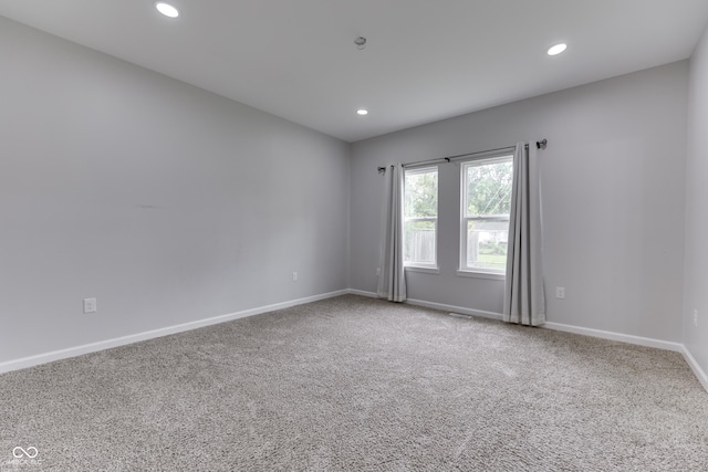 9317 E 36th Pl, Indianapolis, IN 46235 - spare room featuring recessed lighting, carpet, and baseboards
