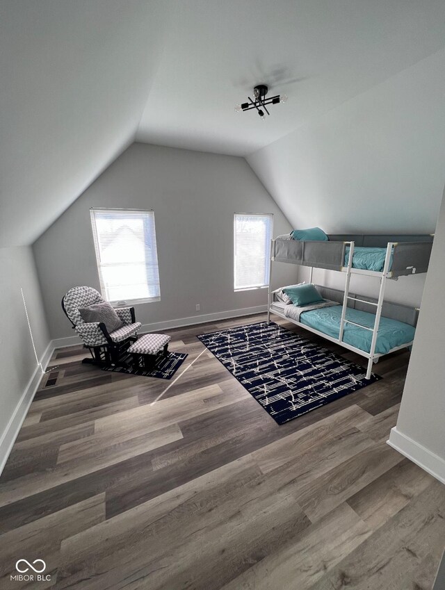 811 E Minnesota St, Indianapolis, IN 46203 - bedroom featuring wood finished floors, lofted ceiling, and baseboards