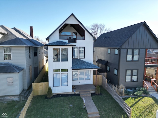 811 E Minnesota St, Indianapolis, IN 46203 - view of front of home with a balcony, board and batten siding, and a shingled roof