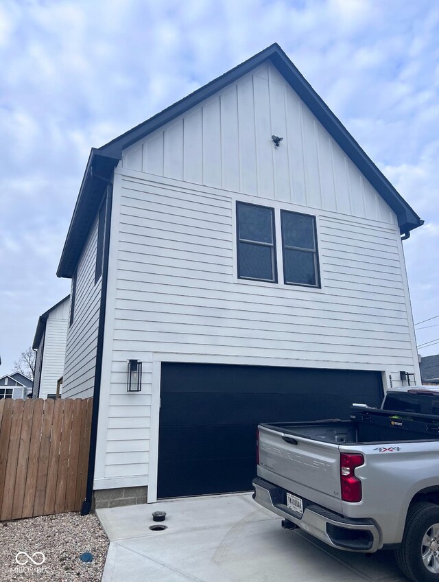 811 E Minnesota St, Indianapolis, IN 46203 - view of side of home featuring a garage and board and batten siding