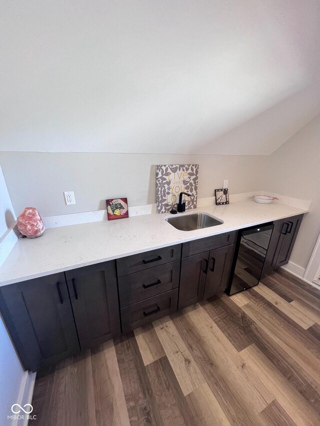 811 E Minnesota St, Indianapolis, IN 46203 - bathroom featuring a sink, wood finished floors, and lofted ceiling