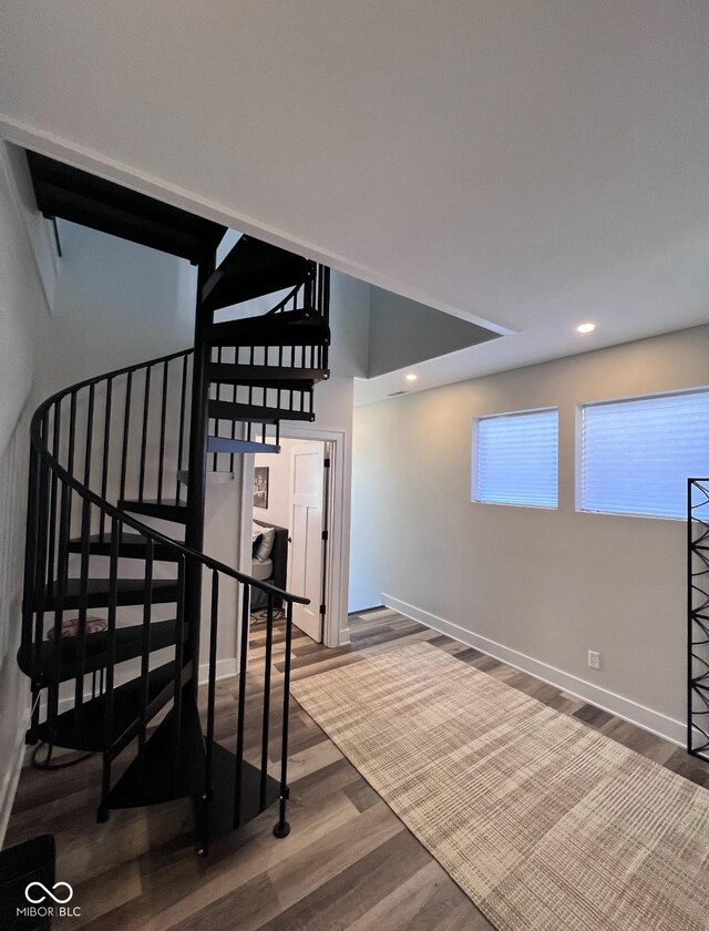 811 E Minnesota St, Indianapolis, IN 46203 - stairway with wood finished floors, baseboards, and recessed lighting