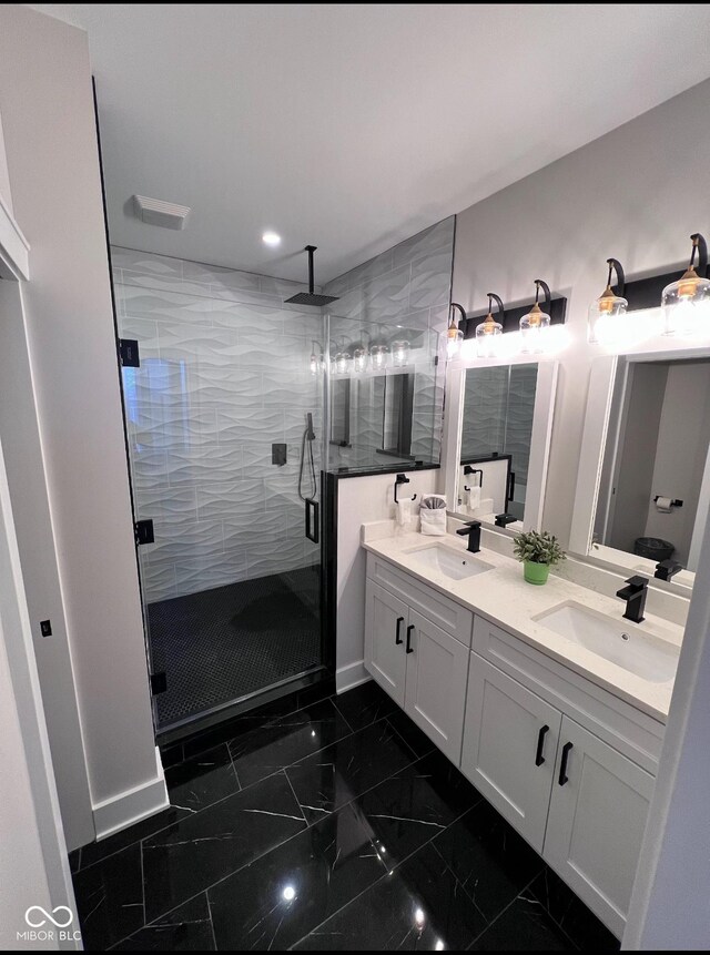 811 E Minnesota St, Indianapolis, IN 46203 - full bathroom with double vanity, marble finish floors, a stall shower, and recessed lighting