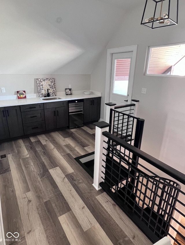 811 E Minnesota St, Indianapolis, IN 46203 - bathroom with vaulted ceiling, a sink, and wood finished floors