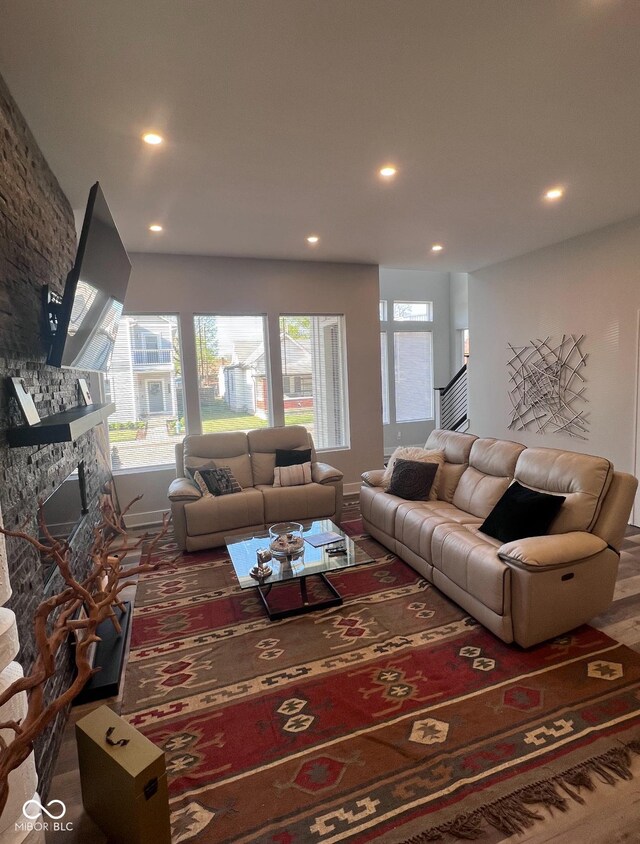 811 E Minnesota St, Indianapolis, IN 46203 - living area with recessed lighting, a stone fireplace, and baseboards