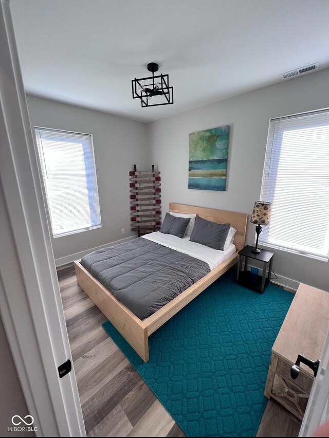 811 E Minnesota St, Indianapolis, IN 46203 - bedroom featuring wood finished floors and baseboards