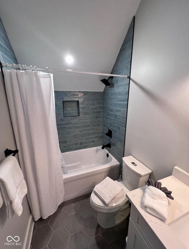 811 E Minnesota St, Indianapolis, IN 46203 - bathroom featuring lofted ceiling, vanity, shower / bath combo with shower curtain, toilet, and tile patterned floors
