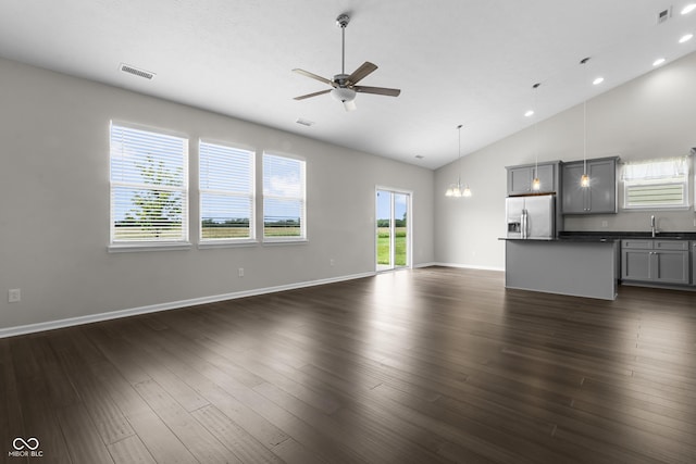 11815 Adair Pl, Indianapolis, IN 46229 - unfurnished living room with a ceiling fan, a sink, baseboards, dark wood-style floors, and high vaulted ceiling