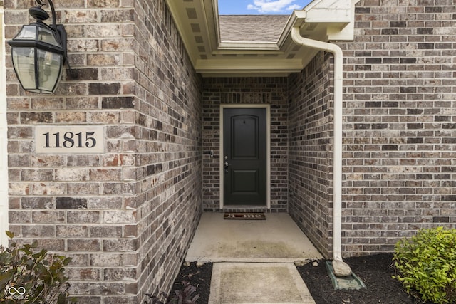 11815 Adair Pl, Indianapolis, IN 46229 - entrance to property featuring brick siding and a shingled roof