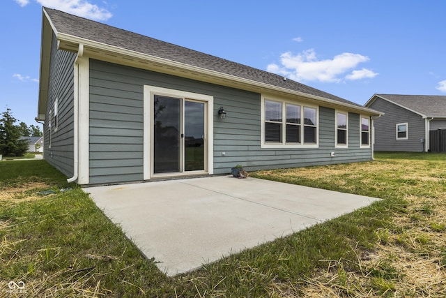 11815 Adair Pl, Indianapolis, IN 46229 - rear view of property with a patio area, a lawn, and roof with shingles
