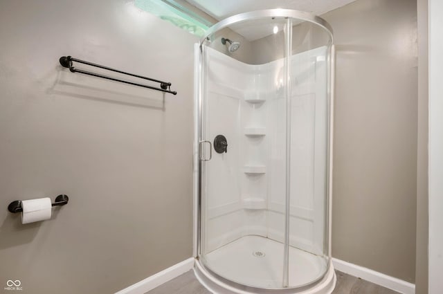 2618 High St, New Castle, IN 47362 - bathroom with a shower stall, baseboards, and wood finished floors