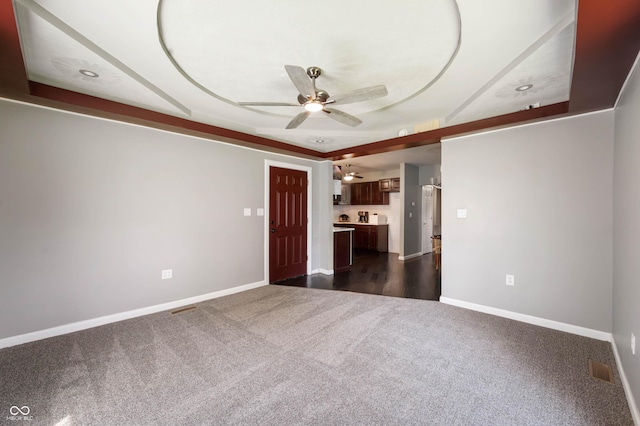 2618 High St, New Castle, IN 47362 - spare room with dark carpet, ceiling fan, and baseboards
