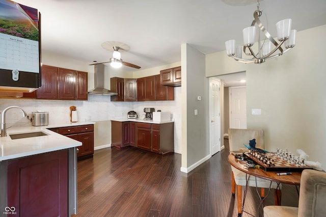 2618 High St, New Castle, IN 47362 - kitchen featuring a sink, wall chimney exhaust hood, dark wood-style flooring, tasteful backsplash, and a chandelier