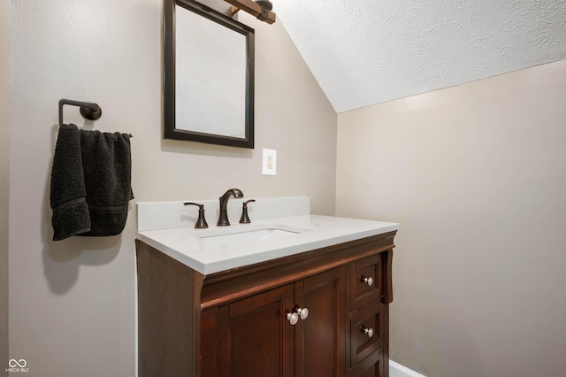 2618 High St, New Castle, IN 47362 - bathroom with vanity, vaulted ceiling, and a textured ceiling