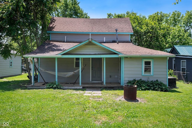 2618 High St, New Castle, IN 47362 - bungalow-style house featuring a front lawn, covered porch, a shingled roof, and central AC