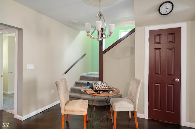 2618 High St, New Castle, IN 47362 - dining room featuring a chandelier, wood finished floors, baseboards, and stairway