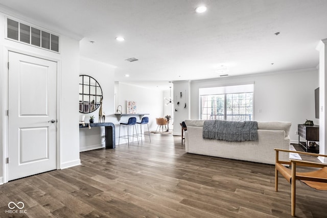 435 Virginia Ave Unit 106, Indianapolis, IN 46203 - living area featuring crown molding, recessed lighting, wood finished floors, and baseboards