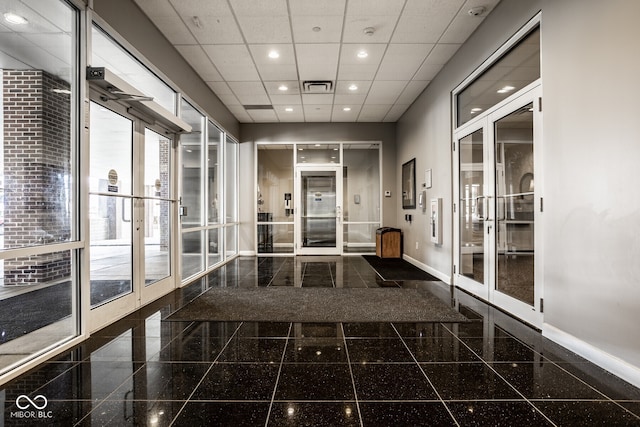 435 Virginia Ave Unit 106, Indianapolis, IN 46203 - hall featuring granite floors, french doors, baseboards, recessed lighting, and a drop ceiling