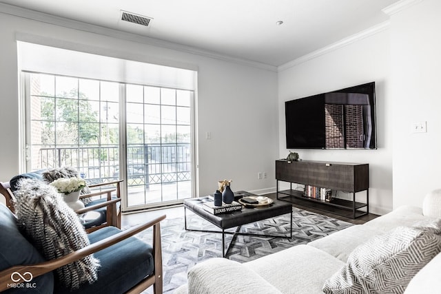 435 Virginia Ave Unit 106, Indianapolis, IN 46203 - living room with plenty of natural light, ornamental molding, wood finished floors, and baseboards
