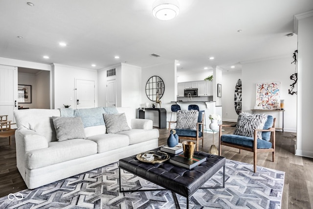 435 Virginia Ave Unit 106, Indianapolis, IN 46203 - living room with ornamental molding, wood finished floors, recessed lighting, and baseboards