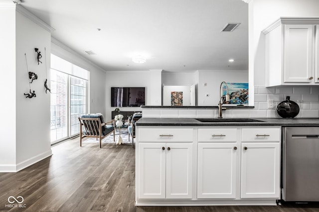 435 Virginia Ave Unit 106, Indianapolis, IN 46203 - kitchen featuring a sink, dishwasher, dark wood-style flooring, ornamental molding, and backsplash