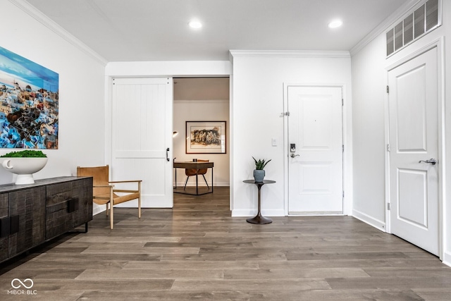 435 Virginia Ave Unit 106, Indianapolis, IN 46203 - foyer entrance featuring ornamental molding, wood finished floors, recessed lighting, and baseboards