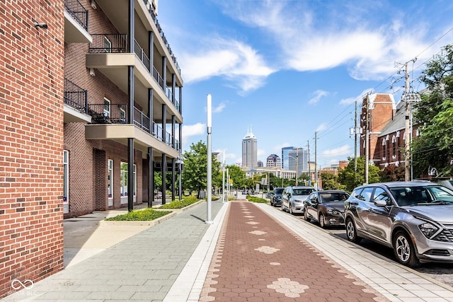 435 Virginia Ave Unit 106, Indianapolis, IN 46203 - view of road featuring sidewalks, a city view, and curbs