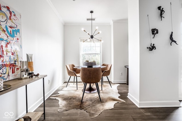 435 Virginia Ave Unit 106, Indianapolis, IN 46203 - dining room featuring ornamental molding, a chandelier, baseboards, and dark wood-type flooring