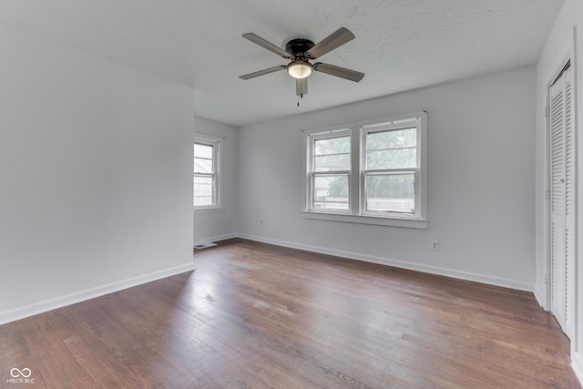 1601 Southern Ave, Beech Grove, IN 46107 - unfurnished bedroom featuring wood finished floors, baseboards, a closet, and ceiling fan