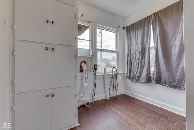 1601 Southern Ave, Beech Grove, IN 46107 - bedroom featuring baseboards, dark wood finished floors, and multiple windows