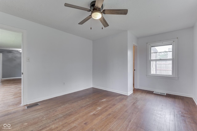 1601 Southern Ave, Beech Grove, IN 46107 - unfurnished room featuring ceiling fan, wood finished floors, and baseboards