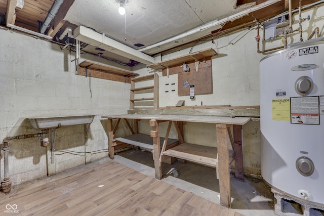 1601 Southern Ave, Beech Grove, IN 46107 - unfinished basement featuring a workshop area, water heater, wood finished floors, and concrete block wall
