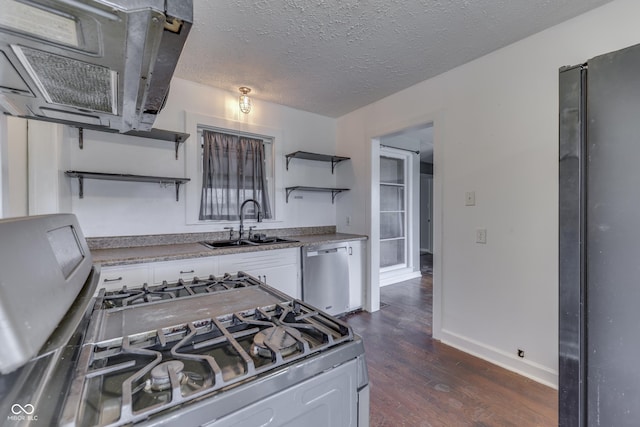 1601 Southern Ave, Beech Grove, IN 46107 - kitchen with open shelves, stainless steel appliances, a sink, dark wood finished floors, and a textured ceiling