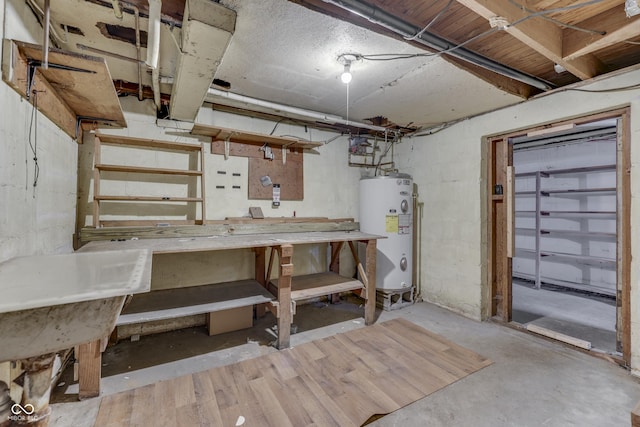 1601 Southern Ave, Beech Grove, IN 46107 - unfinished below grade area featuring electric water heater and a workshop area