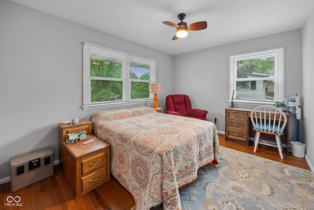 124 Knox Dr, West Lafayette, IN 47906 - bedroom with multiple windows, wood finished floors, ceiling fan, and baseboards
