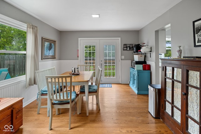 124 Knox Dr, West Lafayette, IN 47906 - dining area featuring french doors, a wainscoted wall, light wood finished floors, and plenty of natural light