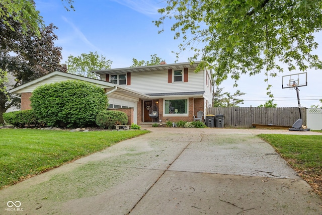 124 Knox Dr, West Lafayette, IN 47906 - traditional-style home with brick siding, an attached garage, and concrete driveway