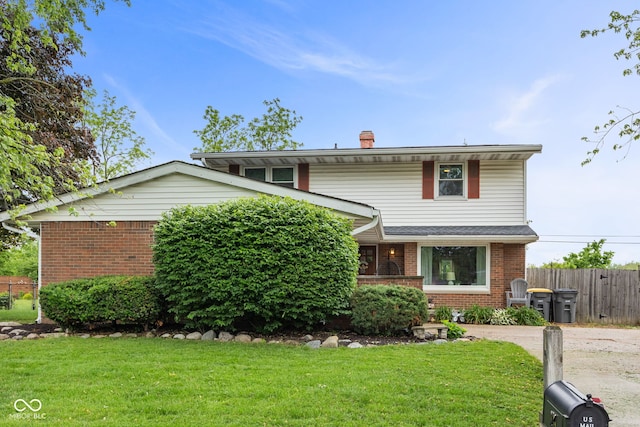 124 Knox Dr, West Lafayette, IN 47906 - view of front facade with brick siding and a chimney