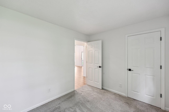 7061 Woodgate Cir, Fishers, IN 46038 - unfurnished bedroom featuring baseboards and carpet
