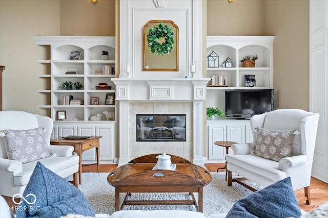 14711 Macduff Dr, Noblesville, IN 46062 - living room featuring a fireplace and wood finished floors